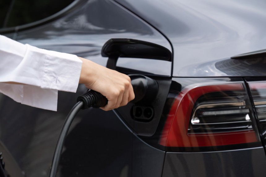 EV charger plug being connected